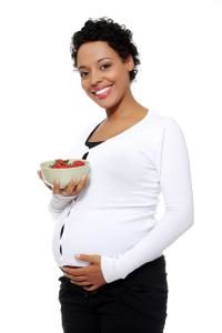 Pregnant woman with strawberries